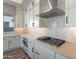 Modern kitchen with stainless steel appliances, light quartz countertops, and a light patterned backsplash at 21422 W Meadowbrook Ave, Buckeye, AZ 85396