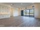 Spacious living room with tile flooring, lots of natural light and sliding glass door to the backyard at 21422 W Meadowbrook Ave, Buckeye, AZ 85396