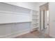 Spacious walk-in closet with ample shelving and storage space at 21422 W Meadowbrook Ave, Buckeye, AZ 85396