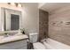 This bathroom features a tiled shower, granite countertops, and vanity at 2223 W 8Th Ave, Mesa, AZ 85202