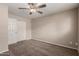 This bedroom features neutral walls, and a closet with sliding doors at 2223 W 8Th Ave, Mesa, AZ 85202