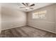 This bedroom has neutral walls, wall trim, and a ceiling fan at 2223 W 8Th Ave, Mesa, AZ 85202