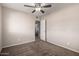 This bedroom features neutral walls and a ceiling fan at 2223 W 8Th Ave, Mesa, AZ 85202