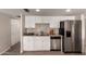 Modern kitchen with stainless steel appliances, white cabinets, and a convenient layout at 2223 W 8Th Ave, Mesa, AZ 85202