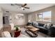 Comfortable living room showcasing a gray sofa, patterned chairs, and lots of natural light at 2223 W 8Th Ave, Mesa, AZ 85202