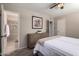 This main bedroom features neutral tones and an ensuite bathroom with tiled shower at 2223 W 8Th Ave, Mesa, AZ 85202