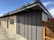 Exterior side of home with a large storage unit and wooden fence at 2307 W Sierra St, Phoenix, AZ 85029