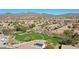 A tranquil park nestled within a suburban community, featuring open green space, playground, and walking paths at 2411 W Oberlin Way, Phoenix, AZ 85085