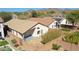 An aerial view of the backyard showcasing a patio, low-maintenance landscaping, and privacy wall at 2411 W Oberlin Way, Phoenix, AZ 85085