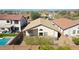 Aerial view of backyard with covered patio, desert landscaping, privacy wall and close to community pool at 2411 W Oberlin Way, Phoenix, AZ 85085