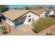 Backyard featuring a covered patio, low-maintenance desert landscaping with stone accents and privacy fence at 2411 W Oberlin Way, Phoenix, AZ 85085