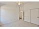 Bedroom with neutral carpet, closet with sliding doors, ceiling fan, and doorway at 2411 W Oberlin Way, Phoenix, AZ 85085