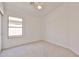 Bedroom with neutral carpet and a window providing natural light at 2411 W Oberlin Way, Phoenix, AZ 85085