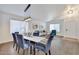 Bright dining area featuring modern table, plush chairs, and stylish pendant lighting at 2411 W Oberlin Way, Phoenix, AZ 85085