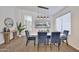 Dining area with modern table setting, stylish decor, and contemporary lighting fixture at 2411 W Oberlin Way, Phoenix, AZ 85085