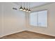 Dining room with modern pendant lighting and wood-look flooring at 2411 W Oberlin Way, Phoenix, AZ 85085