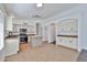 Open kitchen with white cabinets, stainless steel appliances, and a cozy butcher block island at 2411 W Oberlin Way, Phoenix, AZ 85085