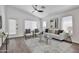 Bright living room with vaulted ceilings, modern furnishings, and neutral color palette at 2411 W Oberlin Way, Phoenix, AZ 85085