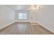 Bright living room with vaulted ceilings and light wood-look floors at 2411 W Oberlin Way, Phoenix, AZ 85085