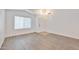 Bright living room with vaulted ceilings and light wood-look floors at 2411 W Oberlin Way, Phoenix, AZ 85085