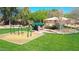 Picturesque park with swing sets, covered picnic tables, and play structures for Gathering fun and gatherings at 2411 W Oberlin Way, Phoenix, AZ 85085