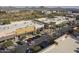 Commercial area with shopping, dining, parking, and palm trees at 2411 W Oberlin Way, Phoenix, AZ 85085