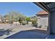 View from the garage, showcasing the well-kept street with landscaping and a glimpse of mountain views at 2411 W Oberlin Way, Phoenix, AZ 85085