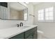 Modern bathroom features a new vanity, quartz countertop, new mirror and plantation shutters at 2938 N 15Th Ave, Phoenix, AZ 85015