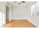 Bright bedroom with hardwood floors, ceiling fan, and white plantation shutters at 2938 N 15Th Ave, Phoenix, AZ 85015