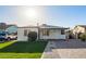Charming single-story home with a well-maintained lawn, walkway, and covered front porch at 2938 N 15Th Ave, Phoenix, AZ 85015