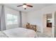 Cozy bedroom with natural light, neutral walls, and a decorative rug under the bed at 3010 N Majestic Ct, Casa Grande, AZ 85122