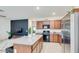 Stylish kitchen showcasing granite counters, stainless steel appliances, and a kitchen island with bar stool seating at 3010 N Majestic Ct, Casa Grande, AZ 85122