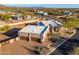 Desert home showcasing a stone facade, 3-car garage, mature landscaping, and a charming courtyard entry at 37015 N 27Th Pl, Cave Creek, AZ 85331