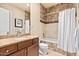 Bathroom features a vanity with countertop, wood cabinets and tile flooring at 37015 N 27Th Pl, Cave Creek, AZ 85331
