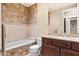An elegant bathroom features tile surround, tub and vanity with counter space at 37015 N 27Th Pl, Cave Creek, AZ 85331