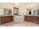 Luxurious bathroom featuring double sinks, jacuzzi tub, and neutral colored tiling at 37015 N 27Th Pl, Cave Creek, AZ 85331