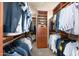 A well-organized walk-in closet with custom shelving and hanging rods, maximizing storage space at 37015 N 27Th Pl, Cave Creek, AZ 85331