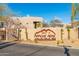 Views at Apache Peak community sign and landscaping, featuring stone accents in a gated entrance area at 37015 N 27Th Pl, Cave Creek, AZ 85331