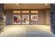 Expansive covered patio overlooking the home's interior through large sliding glass doors at 37015 N 27Th Pl, Cave Creek, AZ 85331