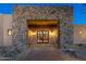Stone entry to desert home with address plaque and double doors at 37015 N 27Th Pl, Cave Creek, AZ 85331