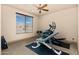An exercise room featuring workout equipment, window, and ceiling fan for an optimum workout environment at 37015 N 27Th Pl, Cave Creek, AZ 85331