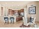 Open concept kitchen with stainless steel appliances, counter seating and adjacent dining area at 37015 N 27Th Pl, Cave Creek, AZ 85331