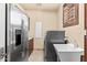 Well-equipped laundry room with stainless steel appliances and a convenient utility sink at 37015 N 27Th Pl, Cave Creek, AZ 85331