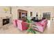 Comfortable living room area with fireplace, TV built-in, and wet bar at 37015 N 27Th Pl, Cave Creek, AZ 85331