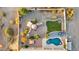 Aerial shot of a landscaped backyard featuring a custom pool, patio area, and lush greenery at 40108 N 2Nd Way, Phoenix, AZ 85086