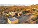 Aerial view of desert home with separate garage, well-manicured landscaping, and mountain views at 40108 N 2Nd Way, Phoenix, AZ 85086
