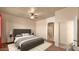 Bedroom featuring a ceiling fan, ensuite bathroom, and relaxing neutral tones at 40108 N 2Nd Way, Phoenix, AZ 85086