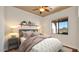 Well-appointed bedroom with a ceiling fan, large window, and a shelf at 40108 N 2Nd Way, Phoenix, AZ 85086