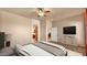 Bedroom featuring a ceiling fan, ensuite bathroom, and relaxing neutral tones at 40108 N 2Nd Way, Phoenix, AZ 85086