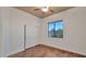 Clean bedroom with a ceiling fan, a large window with outside views, and a closet with sliding doors at 40108 N 2Nd Way, Phoenix, AZ 85086